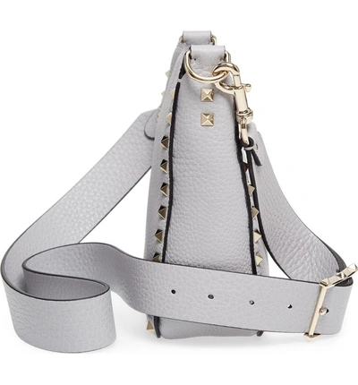 Shop Valentino Rockstud Mini Hobo Crossbody Bag - Grey In Pastel Grey