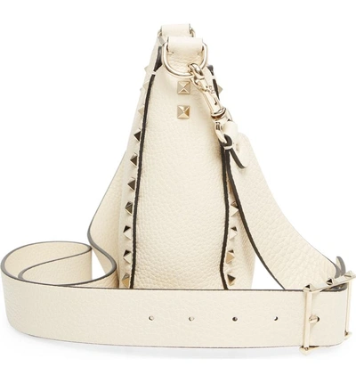Shop Valentino Rockstud Mini Hobo Crossbody Bag In Ivory
