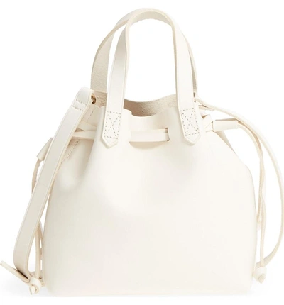 Shop Madewell Mini Drawstring Transport Leather Tote - White In Vintage Canvas