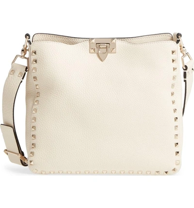 Shop Valentino Small Rockstud Leather Hobo - Ivory