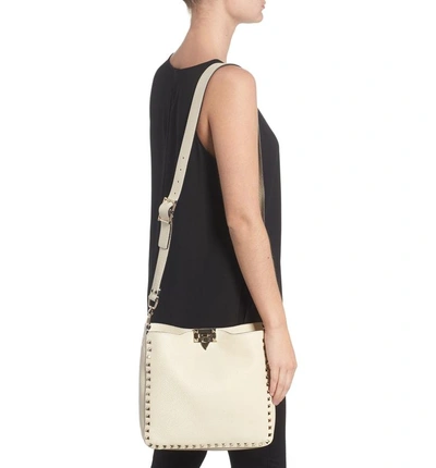 Shop Valentino Small Rockstud Leather Hobo - Ivory