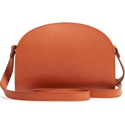 Shop Apc Sac Demi Lune Leather Crossbody Bag - Brown In Caramel