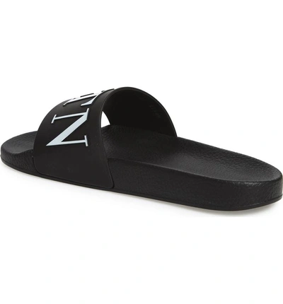 Shop Valentino Slide Sandal In Nero/ Bianco