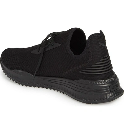 Shop Puma Avid Evoknit Sneaker In Black/ Black
