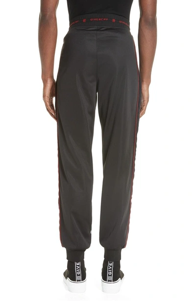 Shop Givenchy Piped Track Pants In Black