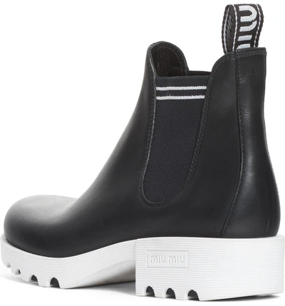 Shop Miu Miu Chelsea Boot In Black/ White