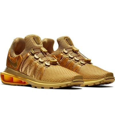 Shop Nike Shox Gravity Sneaker In Metallic Gold/ Metallic Gold