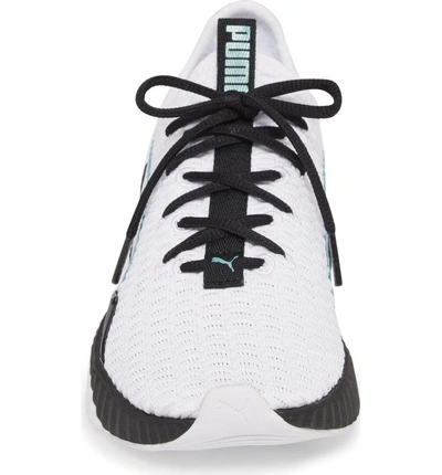 Shop Puma Defy Sneaker In White/ Black
