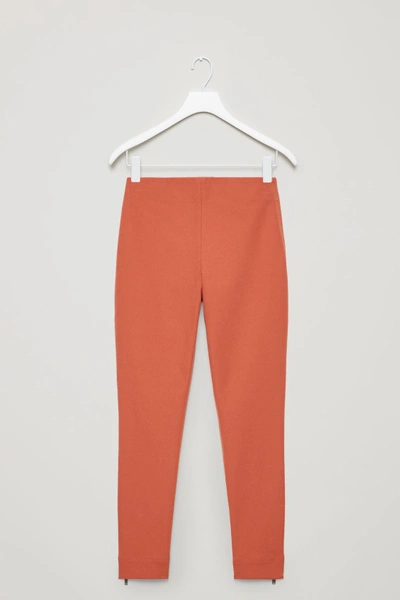 Shop Cos Trousers With Ankle Zips In Orange