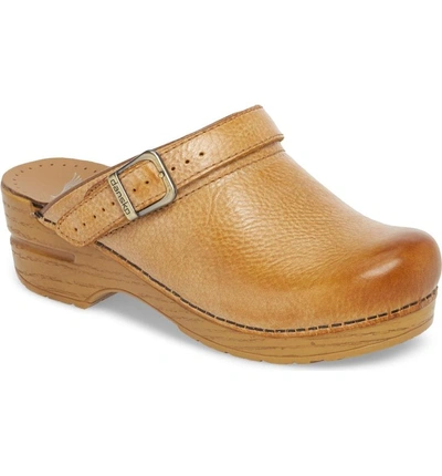 Shop Dansko Ingrid Clog In Honey Distressed Leather