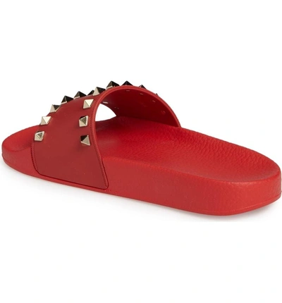 Shop Valentino Rockstud Slide Sandal In Red