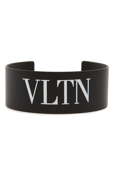 Shop Valentino Vltn Medium Cuff Bracelet In Nero/ Bianco