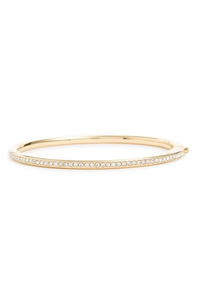Shop Nadri Channel Set Crystal Hinged Bangle In Gold/ Clear Crystal