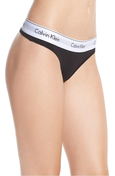 Shop Calvin Klein Logo Thong In Black