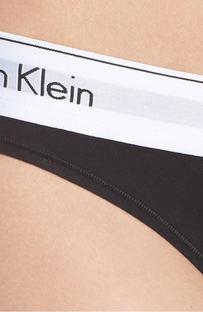 Shop Calvin Klein Logo Thong In Black