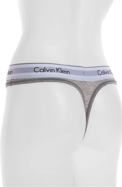 Shop Calvin Klein Logo Thong In Heather Grey