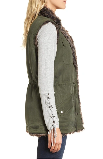 Shop Cupcakes And Cashmere Ashling Faux Fur Lined Utility Vest In Army