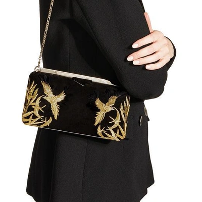 Shop Jimmy Choo Ellipse Black Suede Clutch Bag With Gold Bird Embroidery In Black/gold