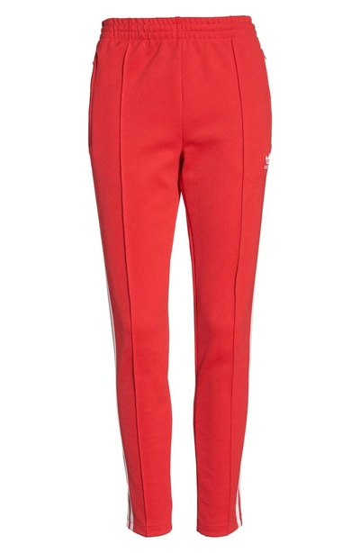Shop Adidas Originals Sst Track Pants In Radiant Red