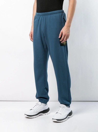 Shop Stone Island Logo Patch Track Pants In Blue