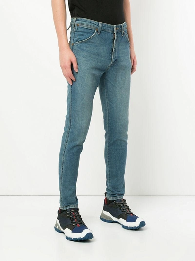 Shop White Mountaineering Classic Skinny Jeans - Blue