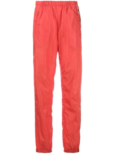 Shop Prada Logo-print Track Trousers - Yellow & Orange