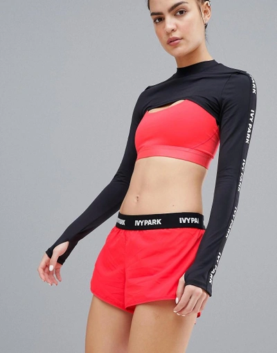 Shop Ivy Park Active Logo Taped Side Stripe Woven Shorts In Red - Red