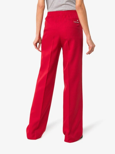 Shop Prada Logo Patch Zip Pocket Track Pants In Red