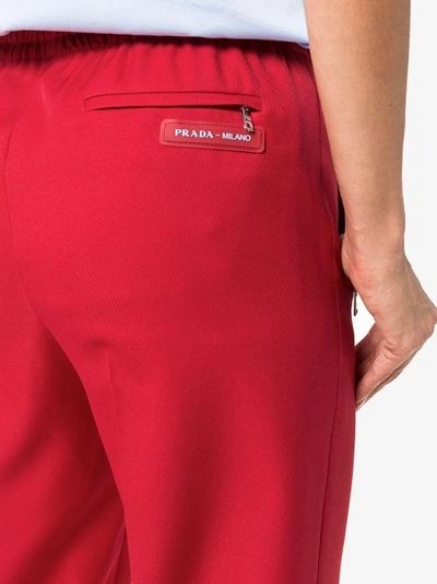 Shop Prada Logo Patch Zip Pocket Track Pants In Red