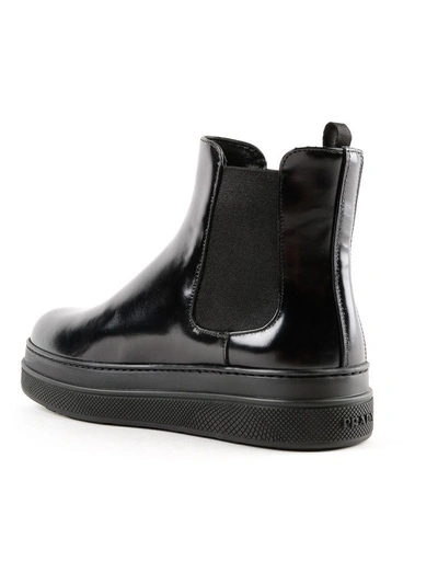 Shop Prada Spazzolato Ankle Boots In Nero