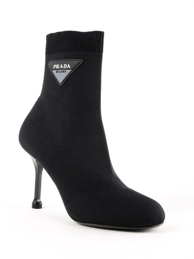 Shop Prada Logo Sock Ankle Boots In Nero