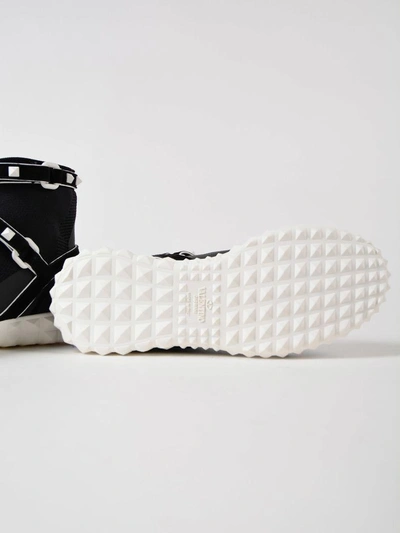 Shop Valentino Rockstud Slip-on Sneakers In 0vp Nero-bianco