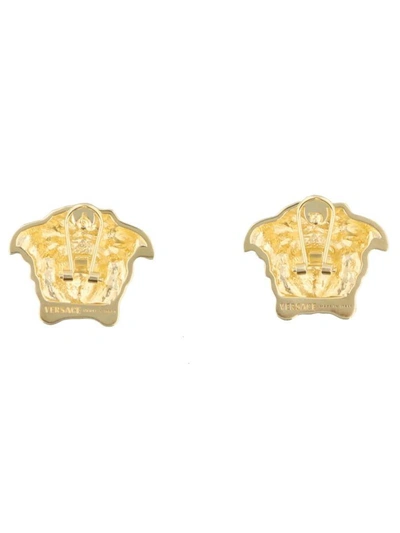 Shop Versace Medusa Earrings In Gold