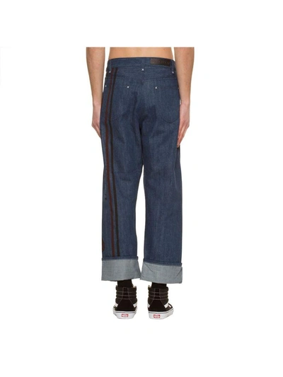 Shop Jw Anderson Printed Fold Front Jeans In Blue