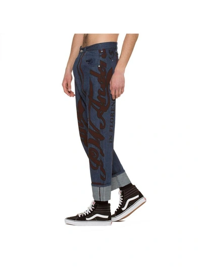 Shop Jw Anderson Printed Fold Front Jeans In Blue