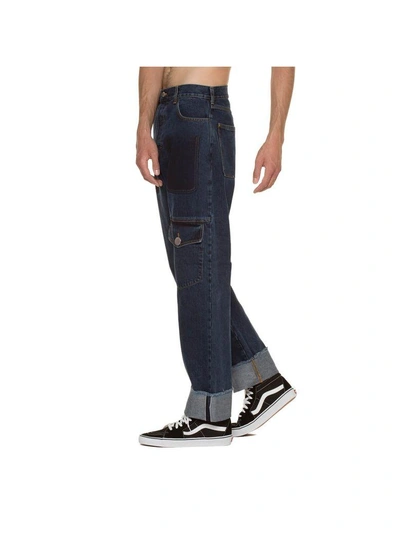 Shop Jw Anderson Multi Pocket Jeans In Blue