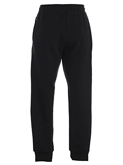 Shop Moschino Logo Track Pants In Black