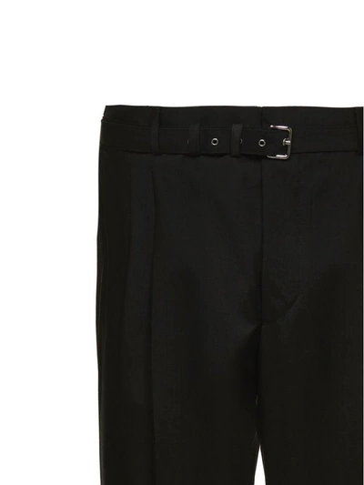 Shop Prada Trousers In Nero