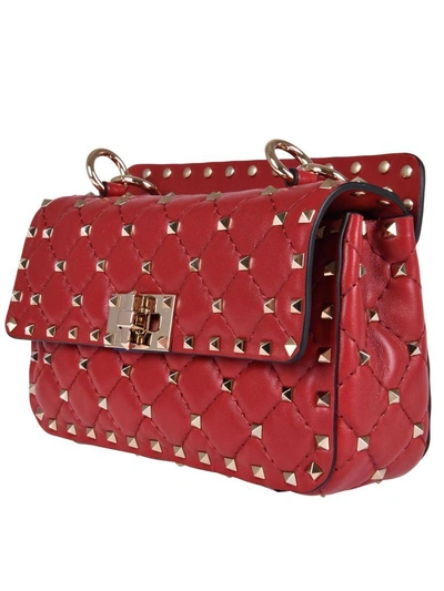 Shop Valentino Rockstud Baby Mini Bag In 0ro Rosso