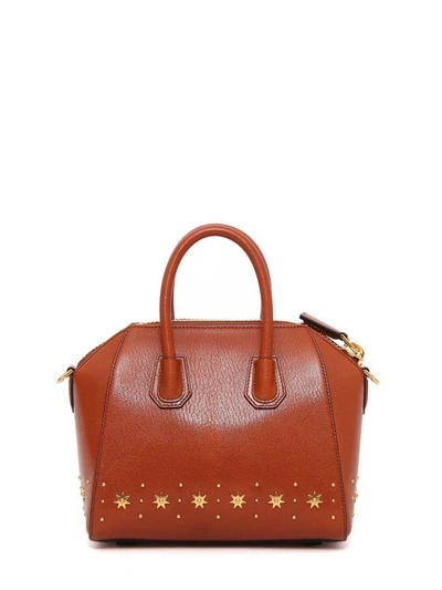 Shop Givenchy Antigona Mini Handbag In Beige