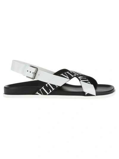 Shop Valentino Vltn Sandals In Nero