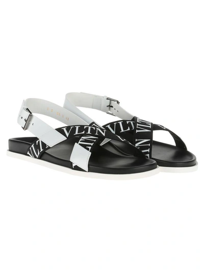 Shop Valentino Vltn Sandals In Nero