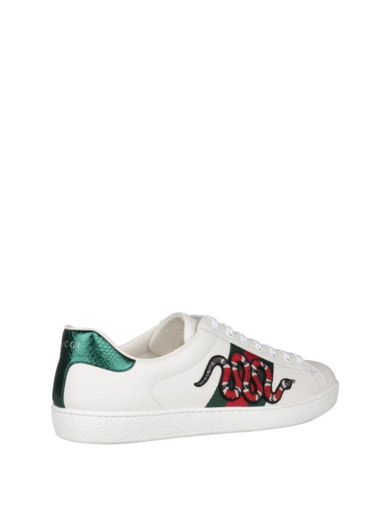 white gucci sneakers with snake