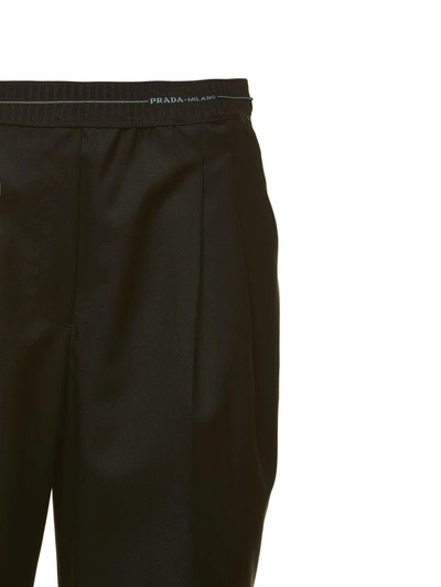 Shop Prada Trousers In Nero