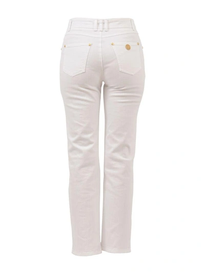Shop Balmain Gold Buttons Jeans In White
