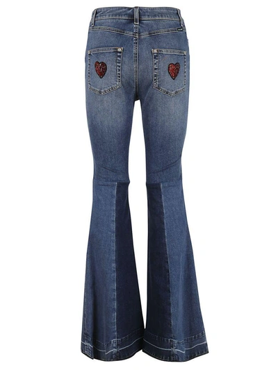 Shop Dolce & Gabbana Flared Amore Jeans In Blue