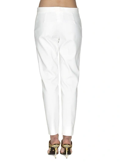 Shop Versace Trousers In Optic White