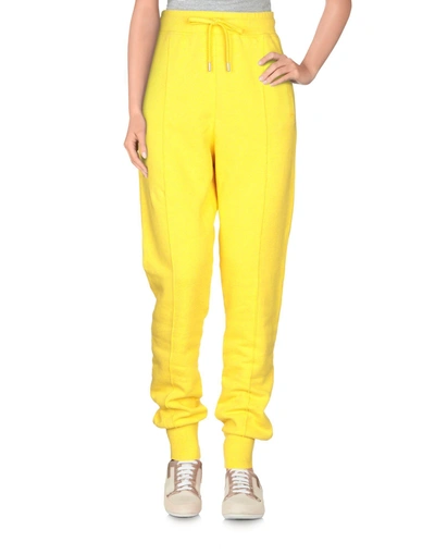 Shop Ganni Casual Pants In Yellow