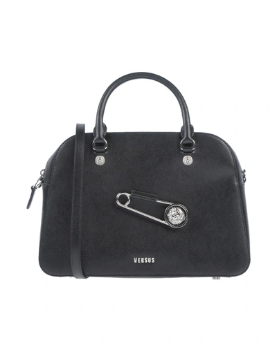 Shop Versus Handbags In Black