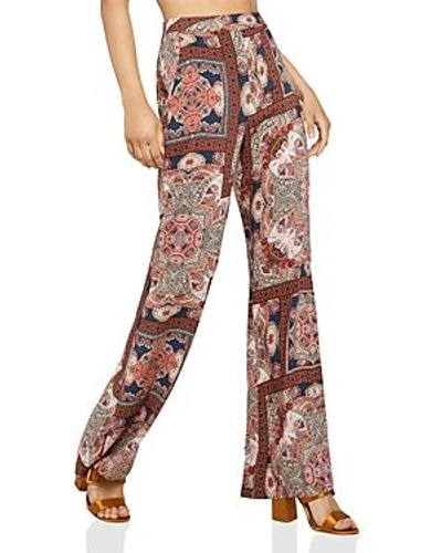 Shop Bcbgeneration Paisley Print Flared Pants In Orange Spice Combo